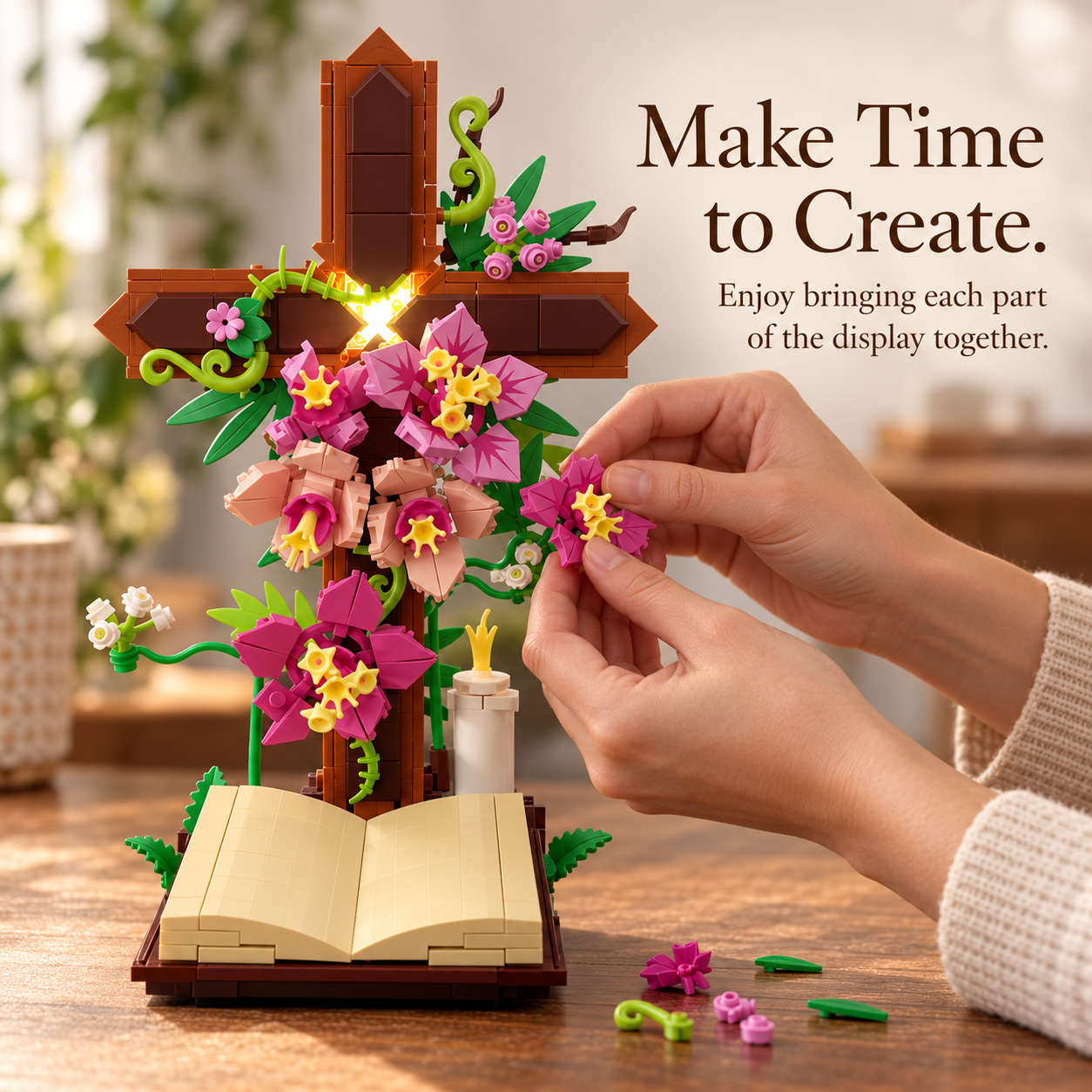 Hands assembling flower pieces onto the floral cross building set