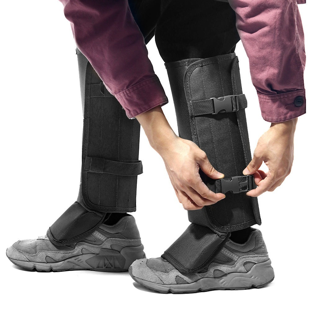 Person fastening black tactical snake gaiters over hiking shoes