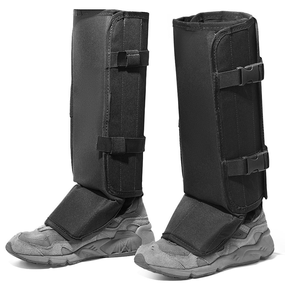 Black protective gaiters showing full shin coverage and extended shoe flaps
