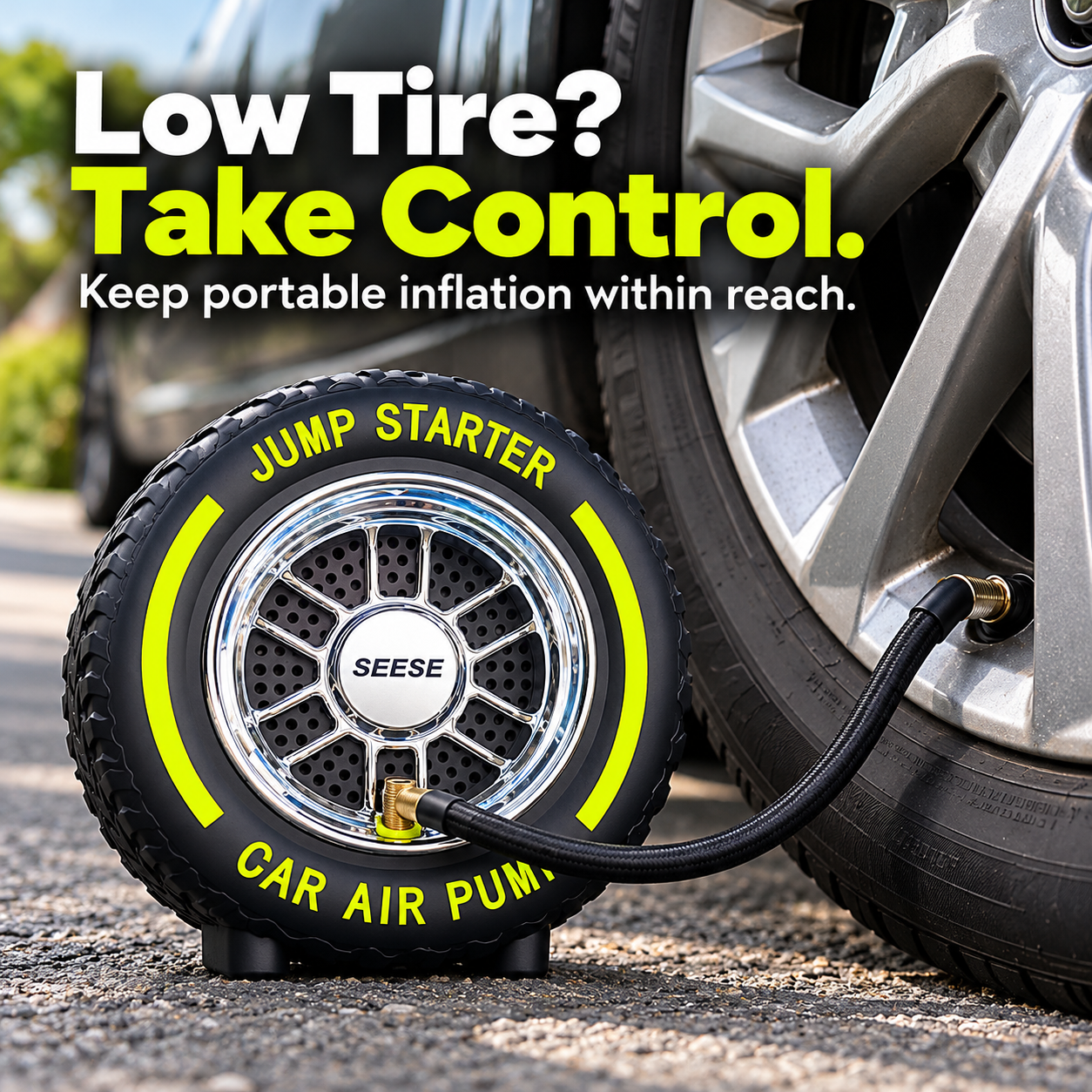 Tire-shaped portable air inflator beside a vehicle wheel with hose connected to tire valve