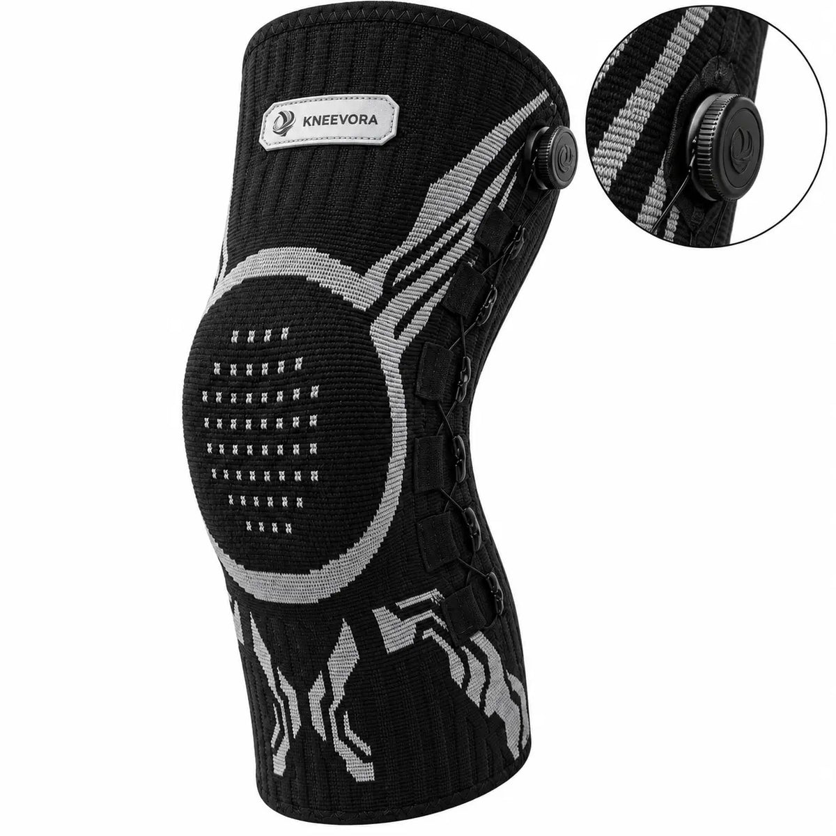 Black and gray knit knee support brace with a circular knee pad, adjustable laces, and an inset detail showing the dial closure system, on a white background.