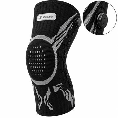 Black and gray knit knee support brace with a circular knee pad, adjustable laces, and an inset detail showing the dial closure system, on a white background.