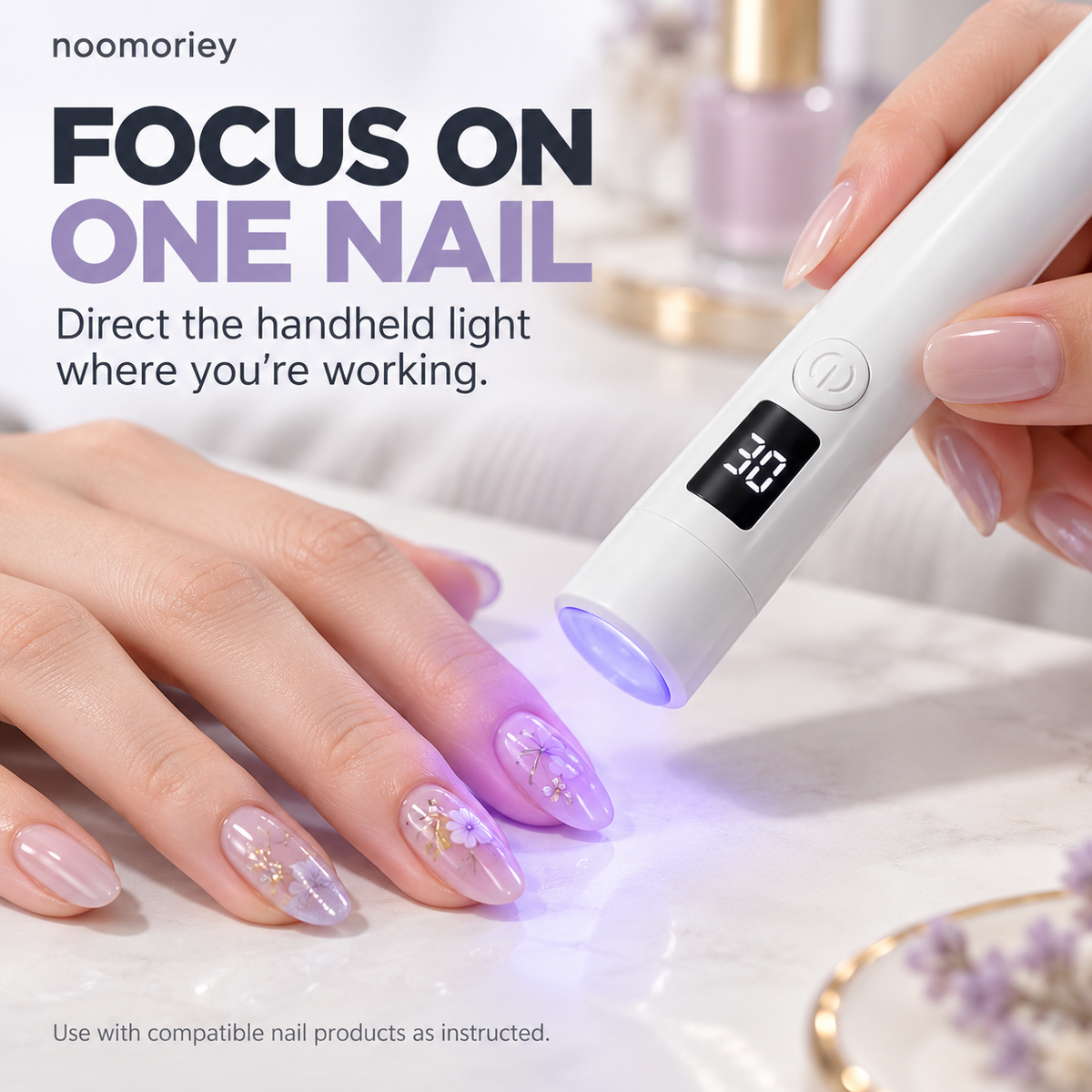 Handheld nail lamp focusing light on one nail