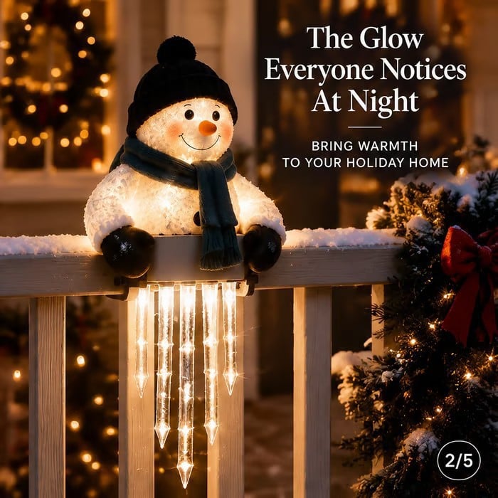 Glowing snowman railing decoration at night