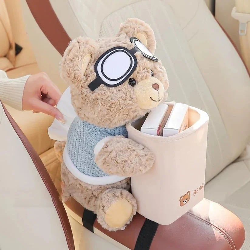 Plush bear car organizer secured on armrest with straps